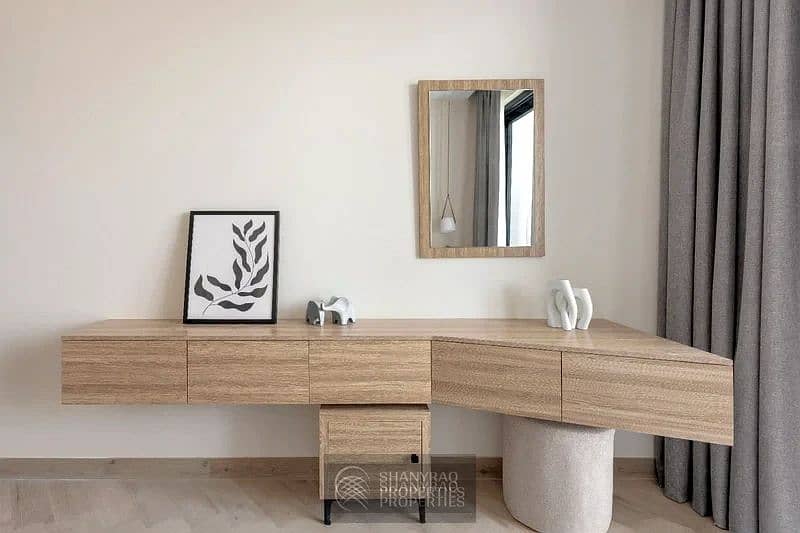 Live Elevated: Stunning High Floor Apartment in JVC with Pool & Burj Al Arab Views! - Image 9