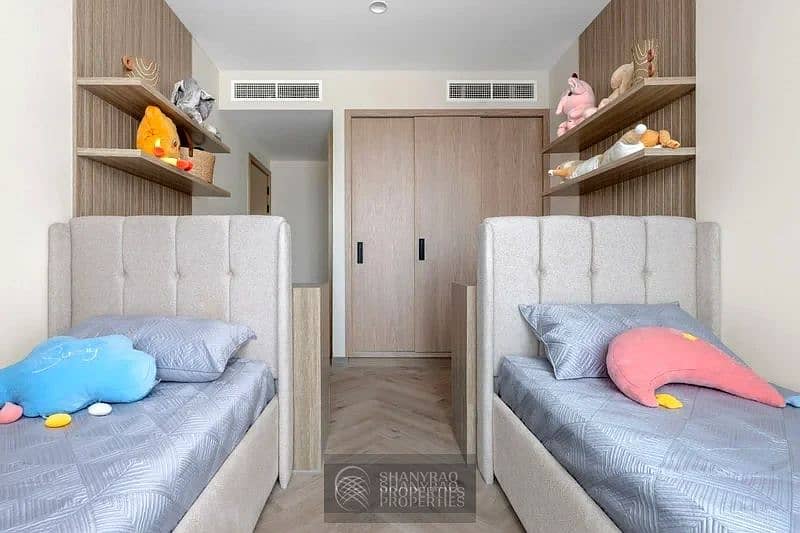 Live Elevated: Stunning High Floor Apartment in JVC with Pool & Burj Al Arab Views! - Image 14