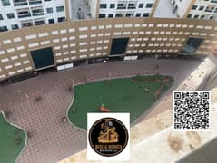 شقة واسعة غرفتين وصالة للإيجار في أبراج اللؤلؤة عجمان | إطلالة على الحديقة