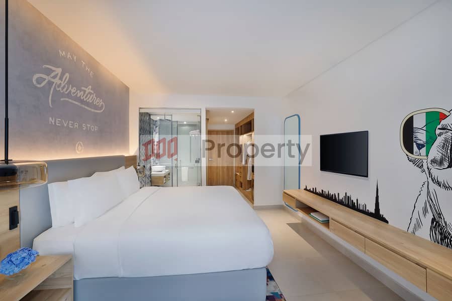 13 NH_Collection_Dubai_The_Palm_Standard_Room_Bedroom_2. jpeg