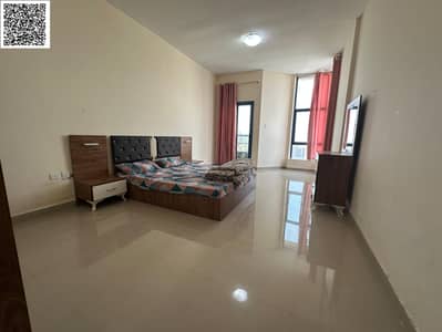Two rooms and a hall, furnished, annually, in Ajman, Al Nuaimiya Towers, Tower C, spacious area with a balcony overlooking the city, with free parking