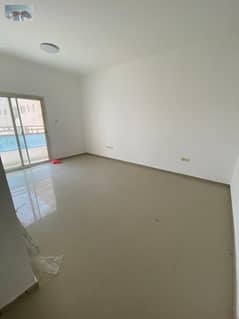 Apartment for rent in Al Nuaimiya 1 – 2 bedrooms, living room, 2 bathrooms, balcony with open view, central AC, clean tower, near Al Ain Palace, free