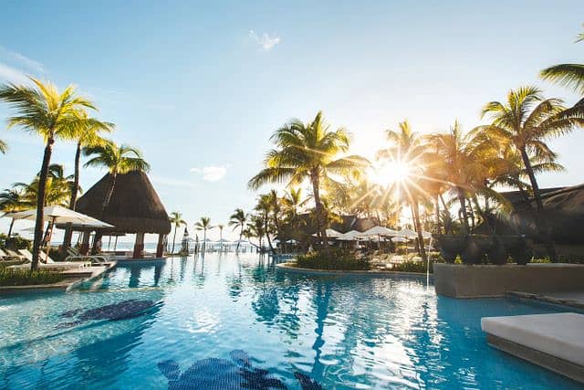 17 swimming-pool-among-palm-trees-on-a-tropical-islan-2022-02-12-05-47-40-utc. jpeg