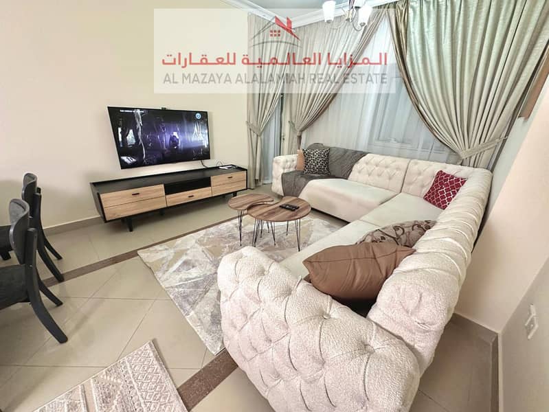 for rent monthly A fully furnished Two-bedroom Two-bathroom apartment in Al Taawun 1