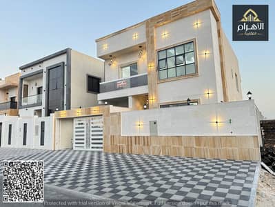 Luxury villa for sale in Ajman, 5 master bedrooms, super deluxe finishing, central air conditioning, including registration fees, close to Sheikh Moha
