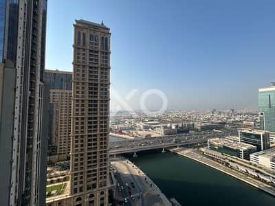 1 Bedroom Apartment for Sale in Business Bay, Dubai - Vacant | Canal and Sea Views | High Floor