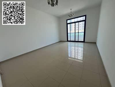 The most luxurious two-bedroom apartment for annual rent in Ajman, with two bathrooms, central air conditioning, a balcony with an open view, and a pr