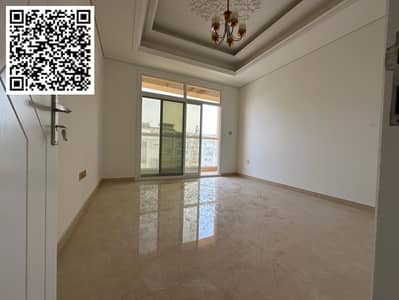 The most luxurious two-bedroom apartment for annual rent in Ajman with two bathrooms, central air conditioning, a balcony with an open view, a gym, an