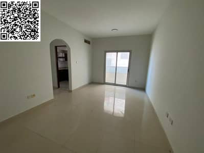Two-bedroom apartment for annual rent in Al Hamidiyah 1, Ajman, near Garden City Towers and Ajman Court, with a balcony and central air conditioning.
