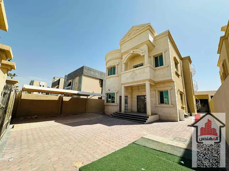 Villa for rent in Al Muwaihat 1 on the street Second occupant Area 5,000 sq ft Consisting of 5 master bedrooms, a living room, 2 halls, 2 kitchens, a maid's room, a storeroom, a spacious courtyard, a parking space, and a large setback in front of the vill - View 2