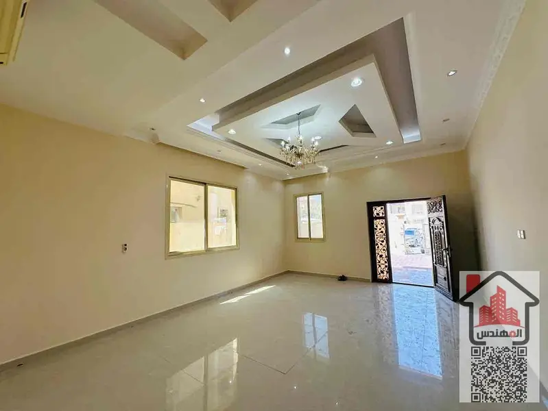Villa for rent in Al Muwaihat 1 on the street Second occupant Area 5,000 sq ft Consisting of 5 master bedrooms, a living room, 2 halls, 2 kitchens, a maid's room, a storeroom, a spacious courtyard, a parking space, and a large setback in front of the vill - More
