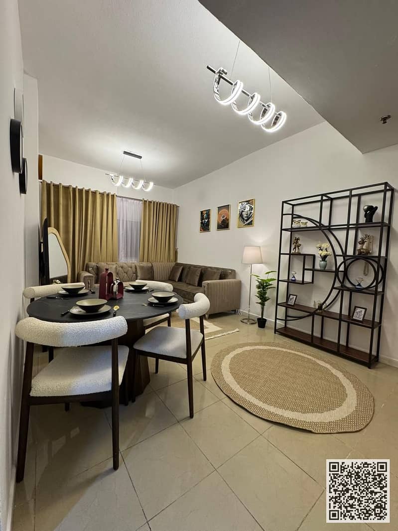 Luxury apartment for monthly rent, one bedroom and a hall with an open view, fully furnished with elegant furniture and a fully equipped kitchen