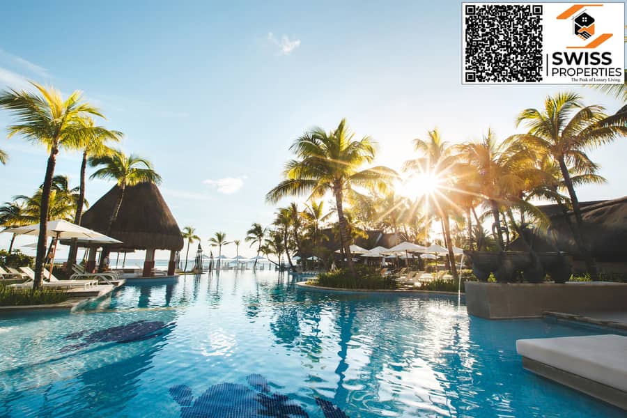 15 swimming-pool-among-palm-trees-on-a-tropical-islan-2022-02-12-05-47-40-utc. jpg