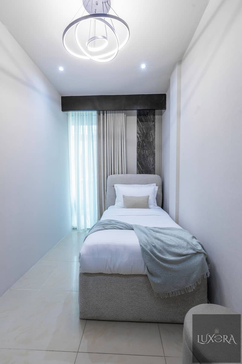 Stylish 2BR in Ubora Tower, Business Bay | Wide Balcony | Pool & Gym - Image 9