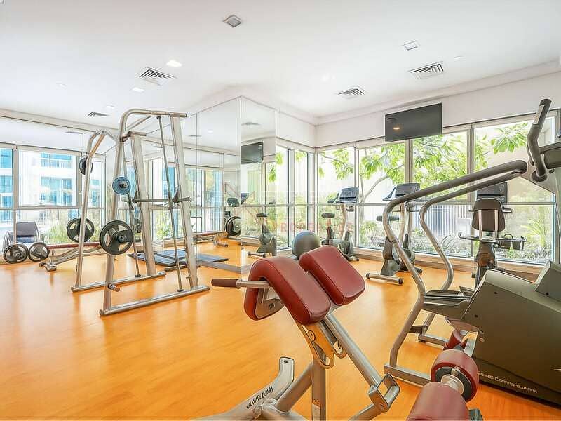 Pool & Community View | Upgraded Unit | Spacious Living Room - Image 10