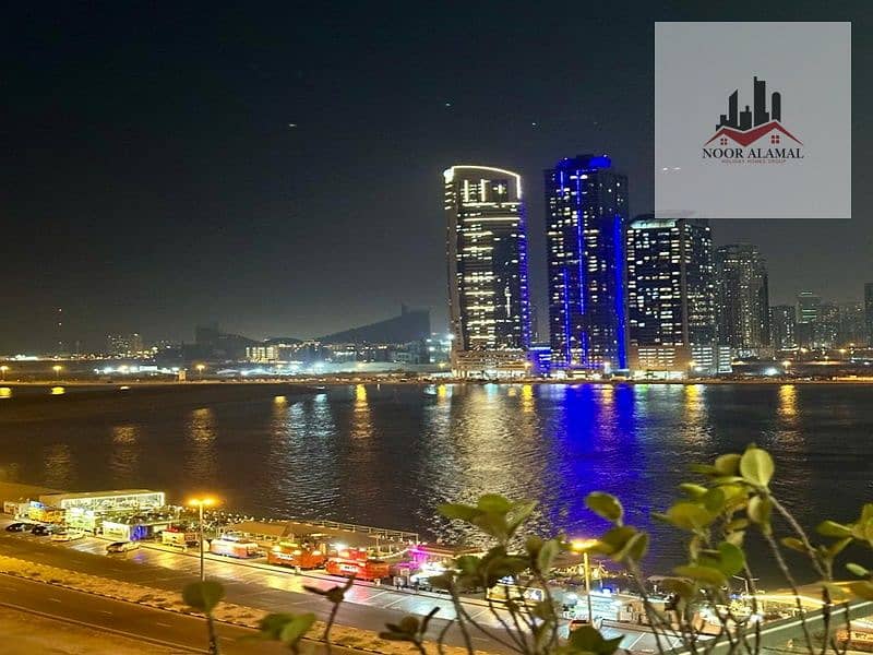 Sharjah, Al Mamzar, Al Abraj Tower, one-bedroom apartment with living room, kitchen, and two bathrooms.