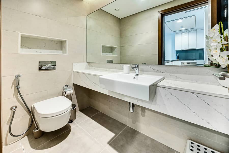 New 1 bedroom in Al-Wasl offering a serene canal-side setting - Image 17