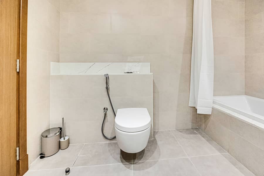 New 1 bedroom in Al-Wasl offering a serene canal-side setting - Image 25