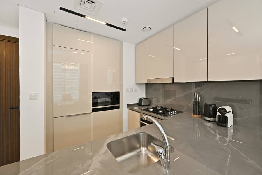 New, Bright & Cozy 1BD at Paragon by IGO, Dubai - Image 16