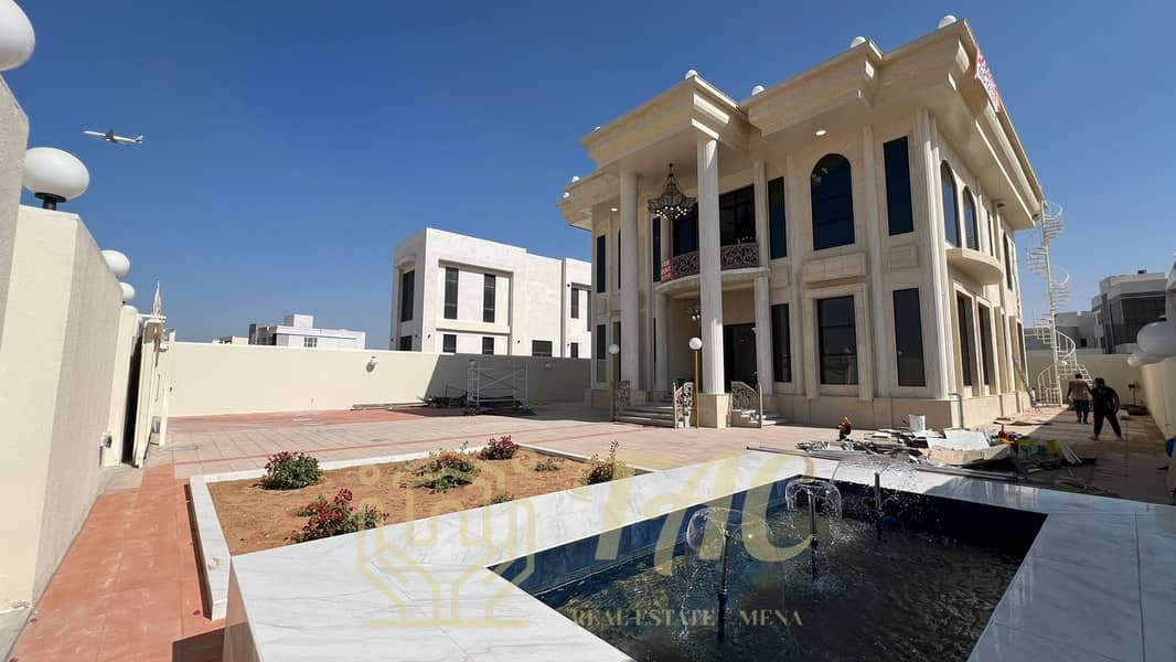 villa in the Mushrif area with a European design in a prime location, directly overlooking the main street, consisting of 6 master bedrooms.