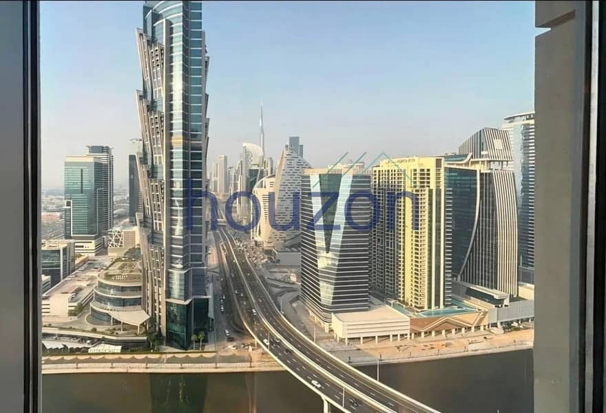 Elegant 2BR | Canal + Sea | Burj View