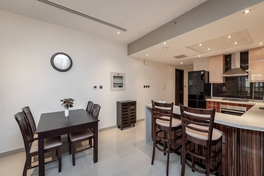 Stylish 1BR Apartment with Canal View | Elite Downtown Residence - Image 11