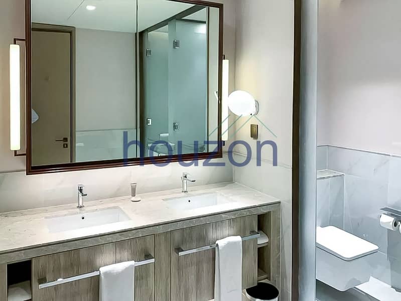 Spacious 2BR | High Floor | Sea + Burj View - Image 12