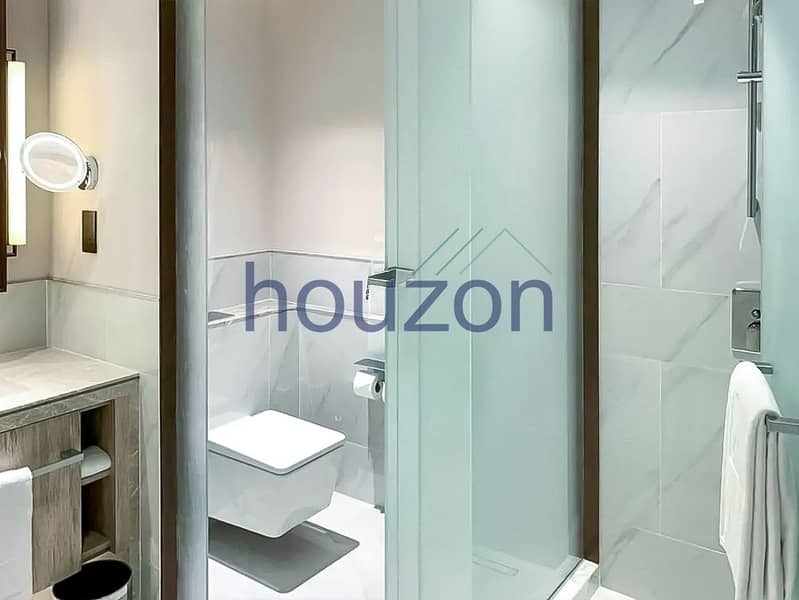 Spacious 2BR | High Floor | Sea + Burj View - Image 13