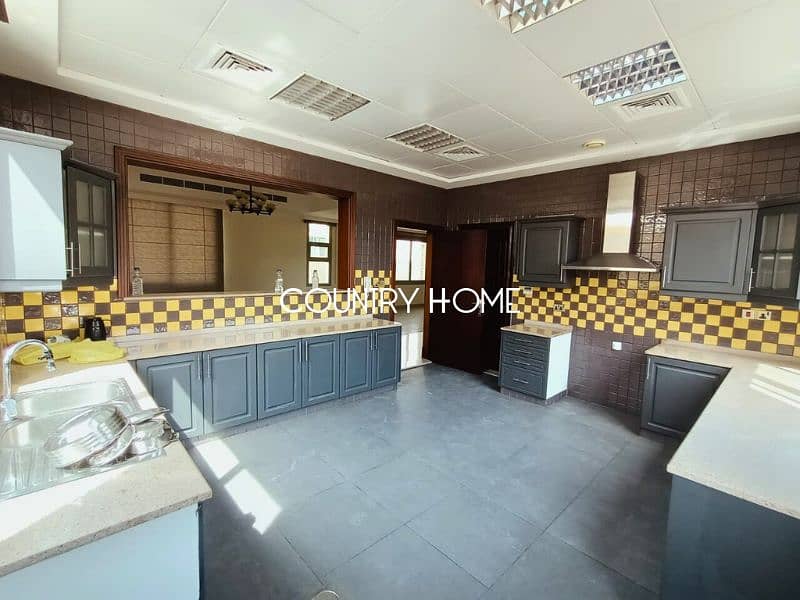 Spacious 5-BR Villa with Study, Private Garden & Close to SZR in Al Manara - Image 9