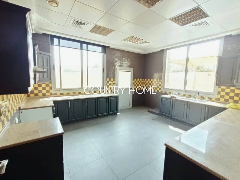 Spacious 5-BR Villa with Study, Private Garden & Close to SZR in Al Manara - Image 10