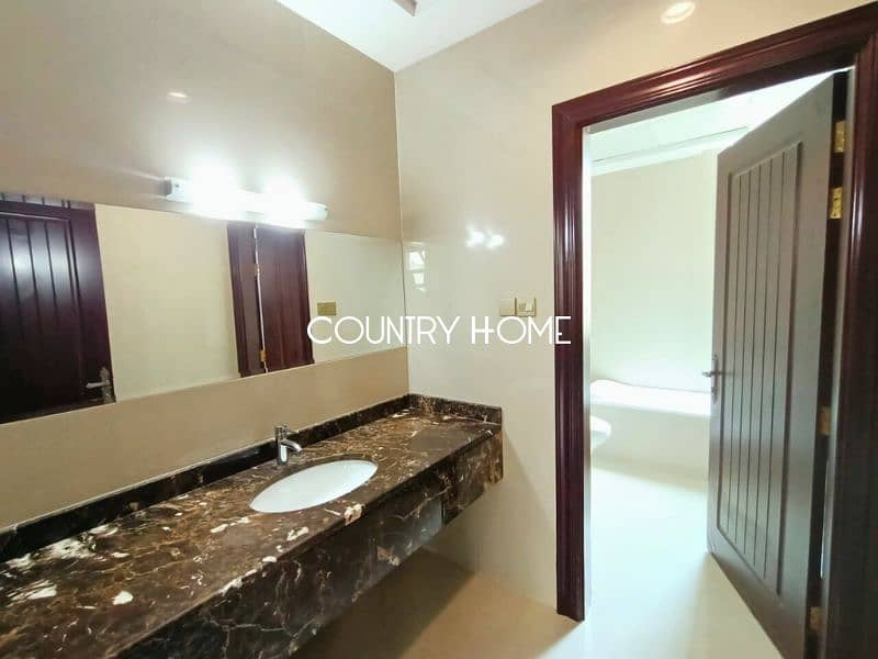 Spacious 5-BR Villa with Study, Private Garden & Close to SZR in Al Manara - Image 13