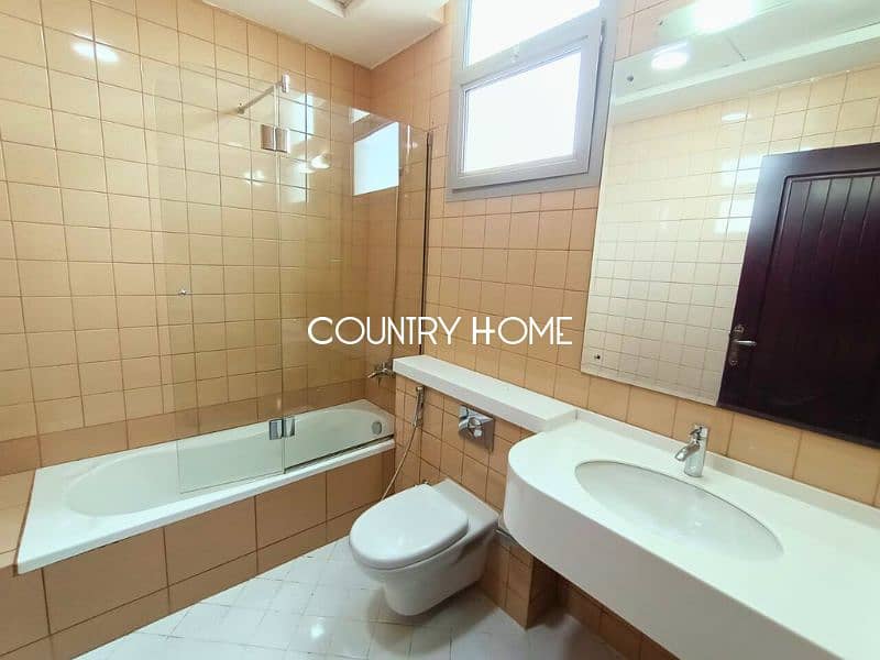 Spacious 5-BR Villa with Study, Private Garden & Close to SZR in Al Manara - Image 14