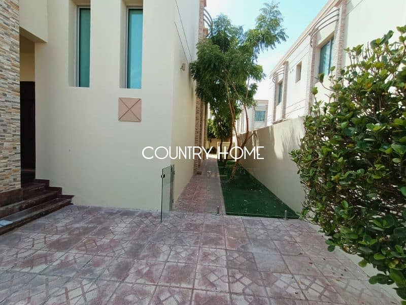 Spacious 5-BR Villa with Study, Private Garden & Close to SZR in Al Manara - Image 16