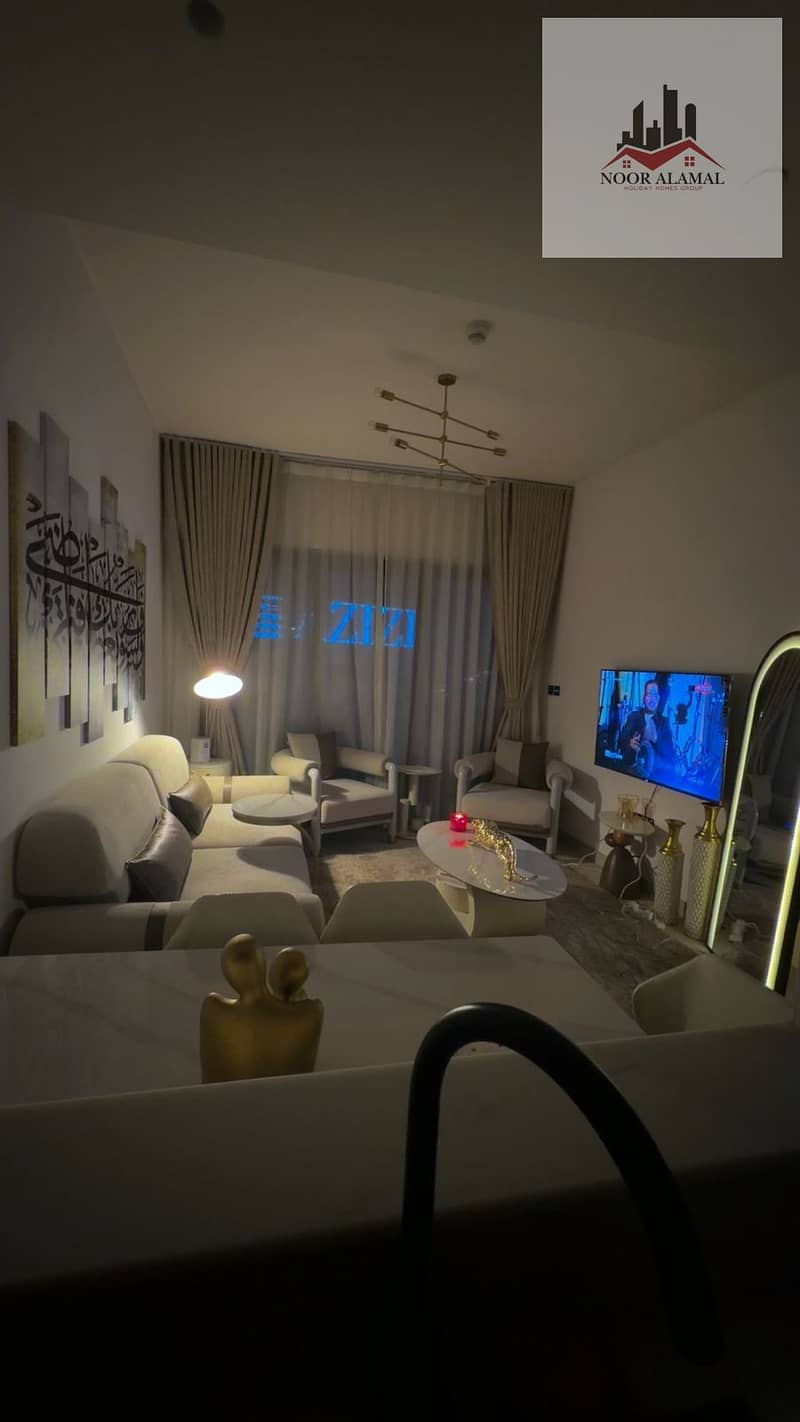 Dubai, fully furnished super deluxe apartment, second occupancy, one bedroom, living room, kitchen, and two bathrooms. Price: 10,000 AED including int