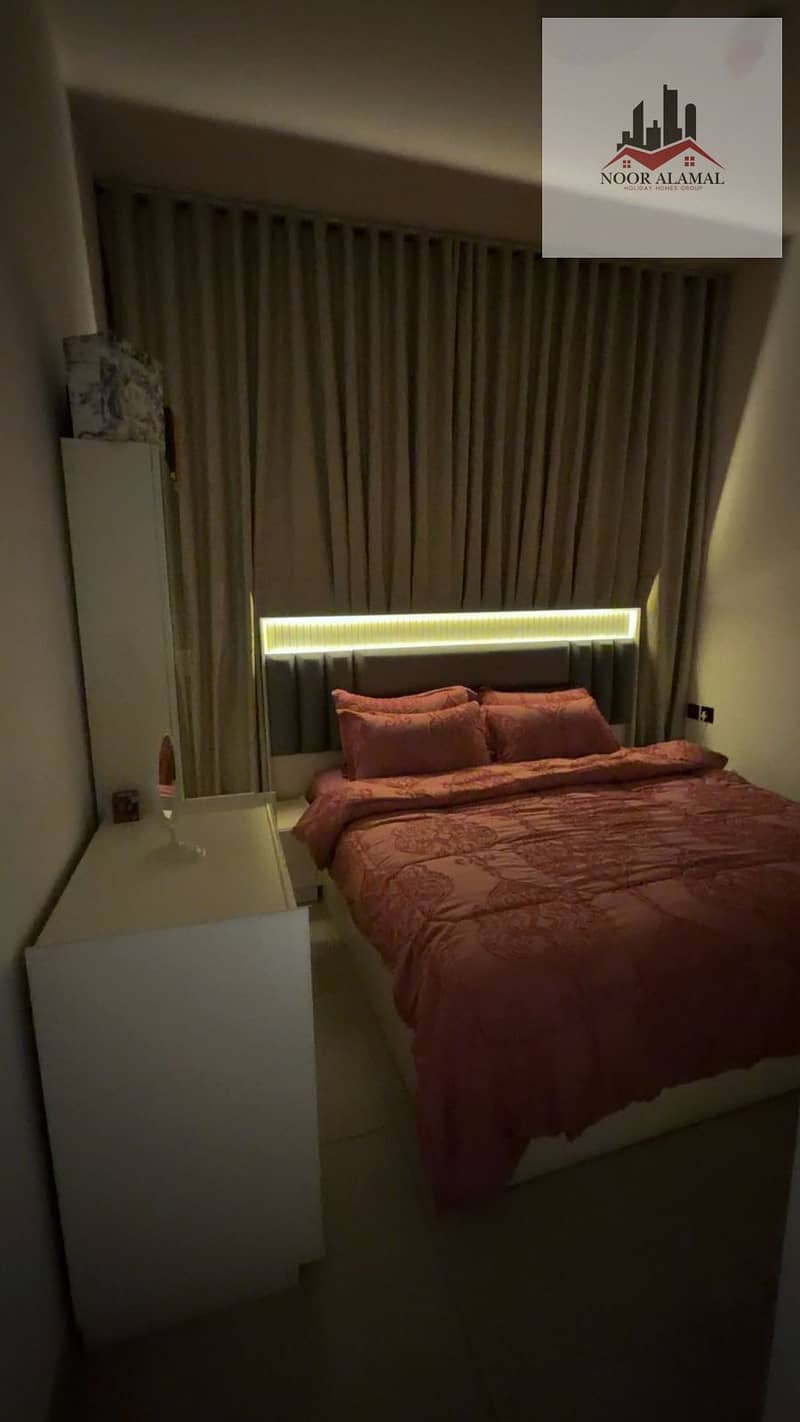 Dubai, fully furnished super deluxe apartment, second occupancy, one bedroom, living room, kitchen, and two bathrooms. Price: 10,000 AED including int