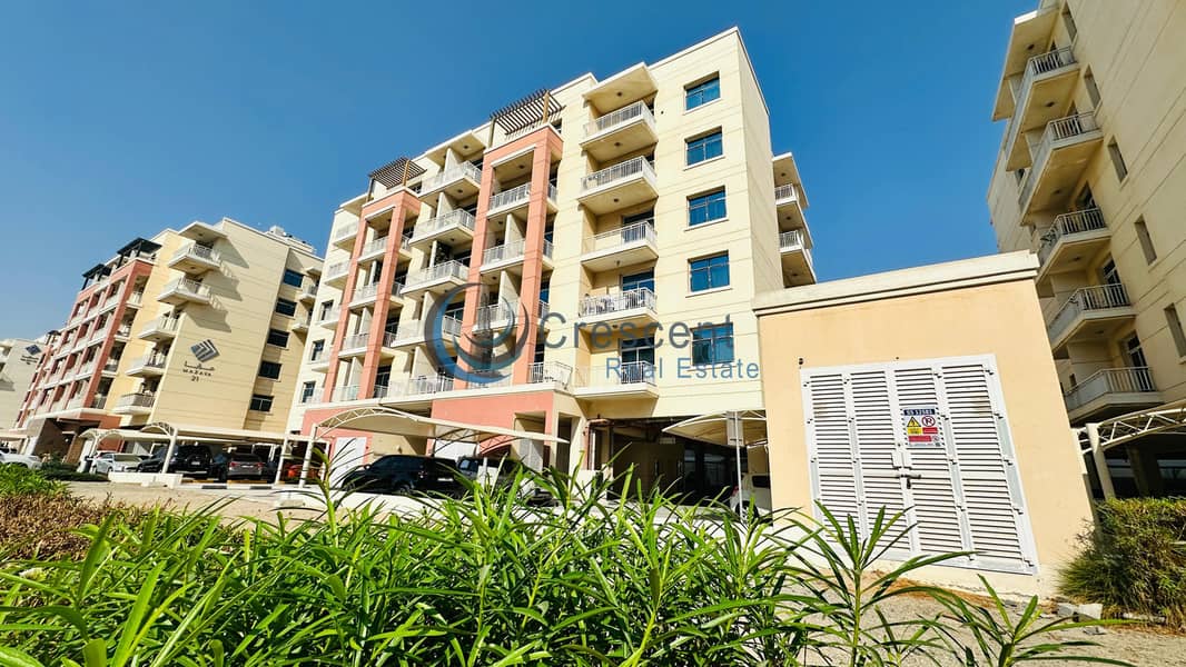 Spacious 1BR Apartment in Mazaya 23 | Liwan