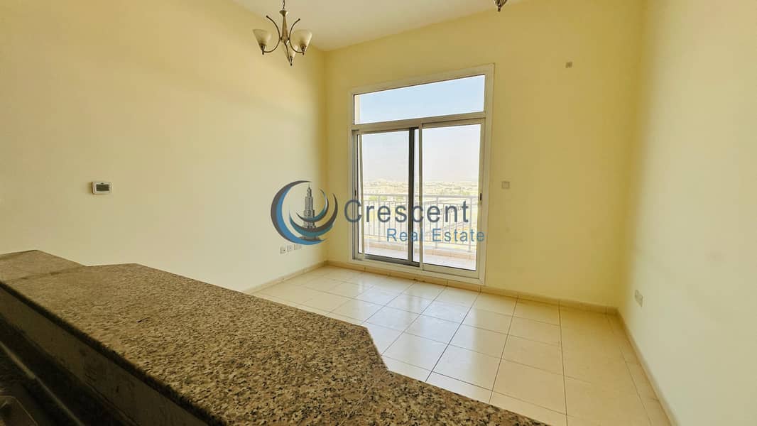 Spacious 1BR Apartment in Mazaya 23 | Liwan