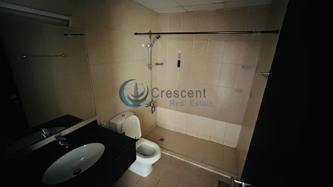 Spacious 1BR Apartment in Mazaya 23 | Liwan - Image 18