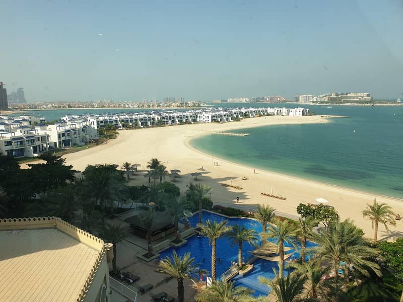 Waterfront development hugs the shores and is caressed by the lapping sea Waterfront development hugs the shores and is caressed by the lapping sea