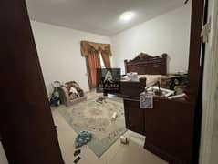 Two bedrooms, a living room, a maid's room, three bathrooms, and two balconies in Al Rashidiya 1, Al Khawar Towers