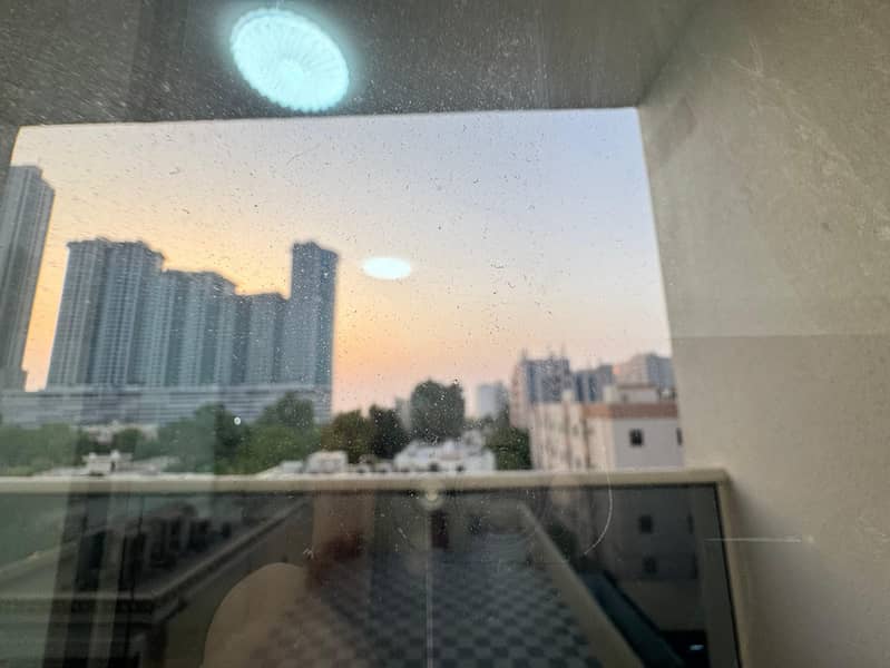 Furnished 2-bedroom apartment for monthly rent in Ajman Corniche, balcony, 3 bathrooms, utilities included.