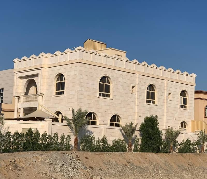 Villa for sale in Ajman Mokhihat two floors with electricity and water and stone face fully