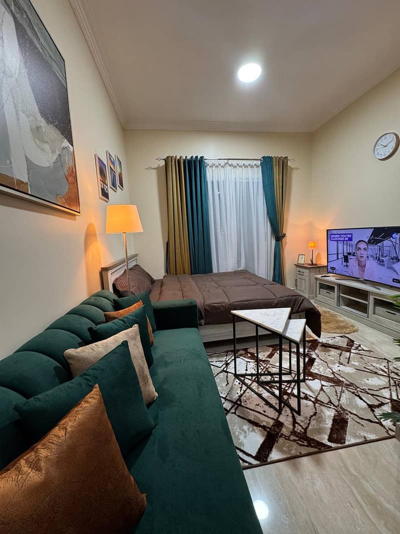 Furnished studio for monthly rent in Al Jurf 2, Ajman. First occupancy, spacious layout, clean furniture, and all bills included. Prime location
