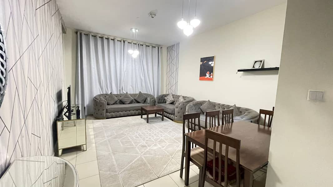 Furnished 2-bedroom apartment for monthly rent in Ajman One Towers, spacious layout, prime location, all bills and internet included.