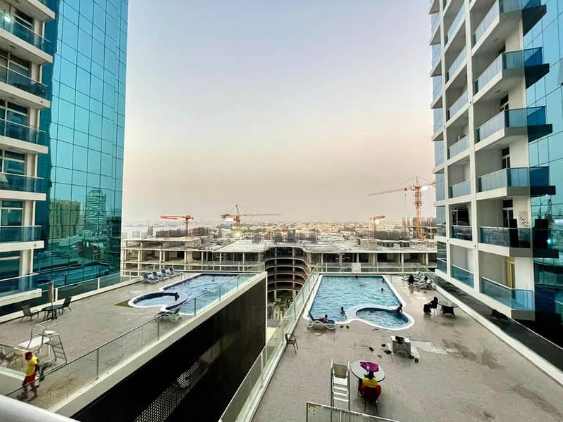 Furnished 2-bedroom apartment for monthly rent in Al Waha Towers, Al Rashidiya. Spacious layout, full creek view, all bills included with parking, gym