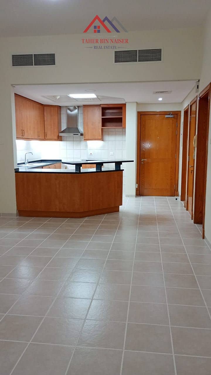 “Spacious 1-Bedroom Apartment With Balcony | Near Metro | Discovery Gardens”