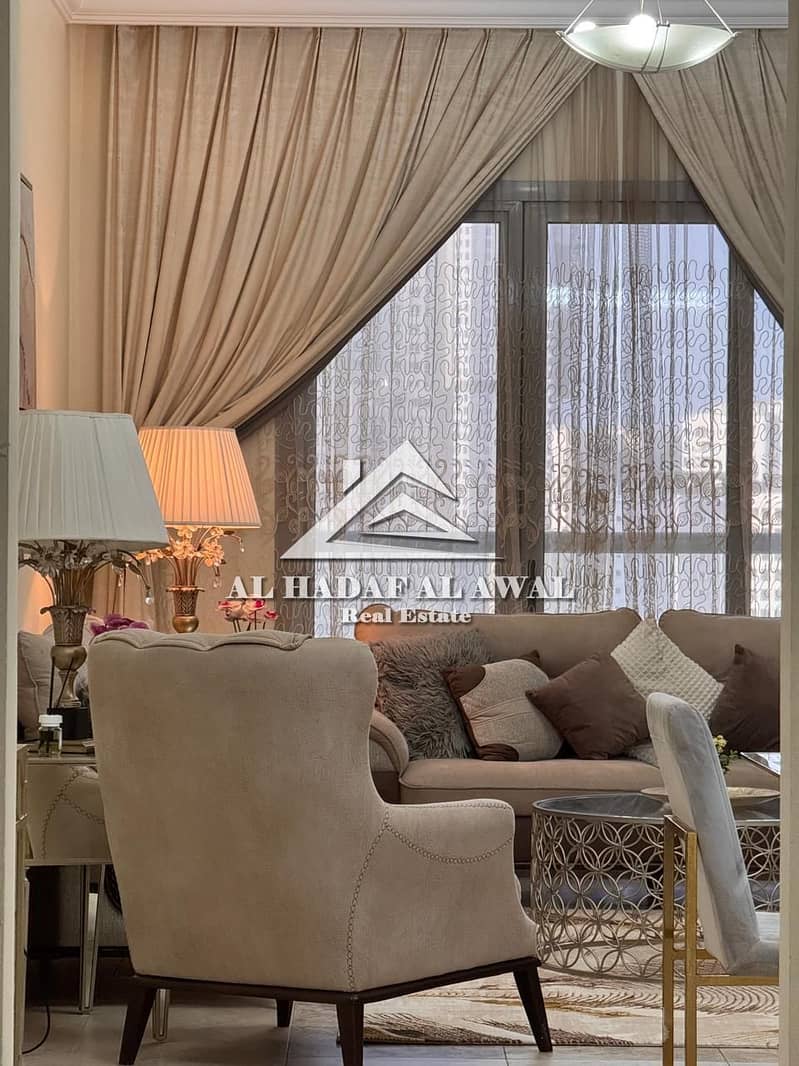 Sharjah, Al Taawun Style Tower, 3 bedrooms, living room, balcony, view, VIP furnishings, master bedrooms with 3 bathrooms, 9000 AED plus 1200 AED secu