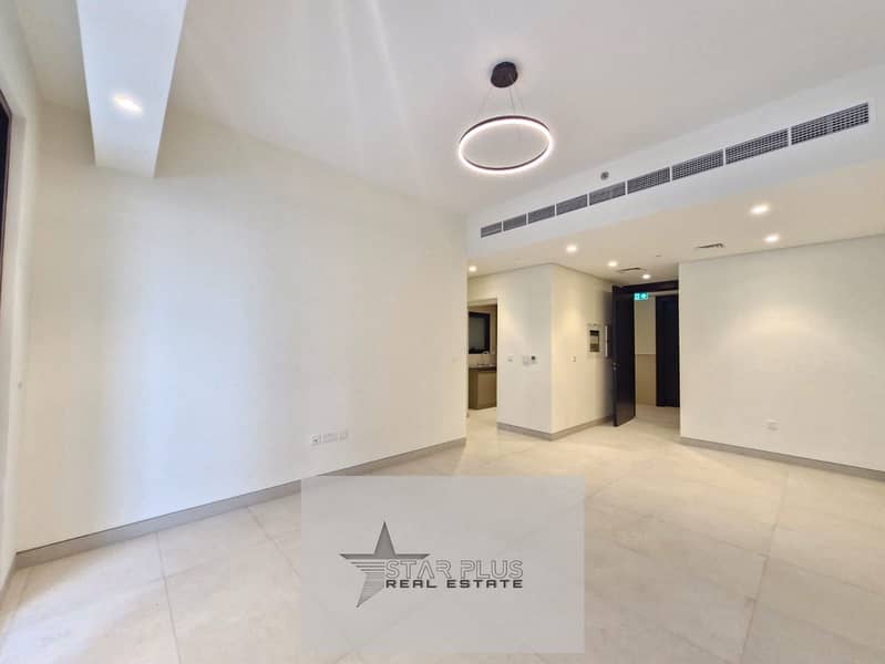 BRAND NEW SPACIOUS 1 BEDROOM APARTMENT WITH CLOSED KITCHEN,2 BALCONIES HAVING GYM,POOL AND COVERED PARKING.