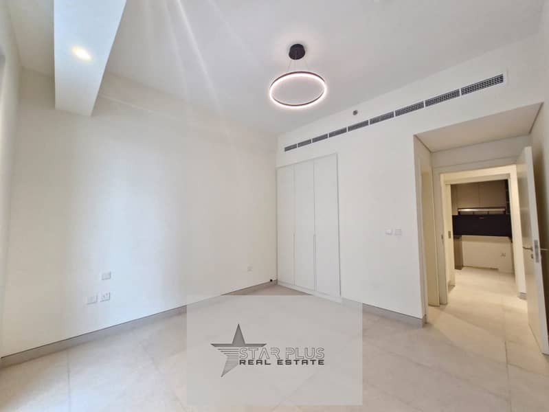 BRAND NEW SPACIOUS 1 BEDROOM APARTMENT WITH CLOSED KITCHEN,2 BALCONIES HAVING GYM,POOL AND COVERED PARKING.