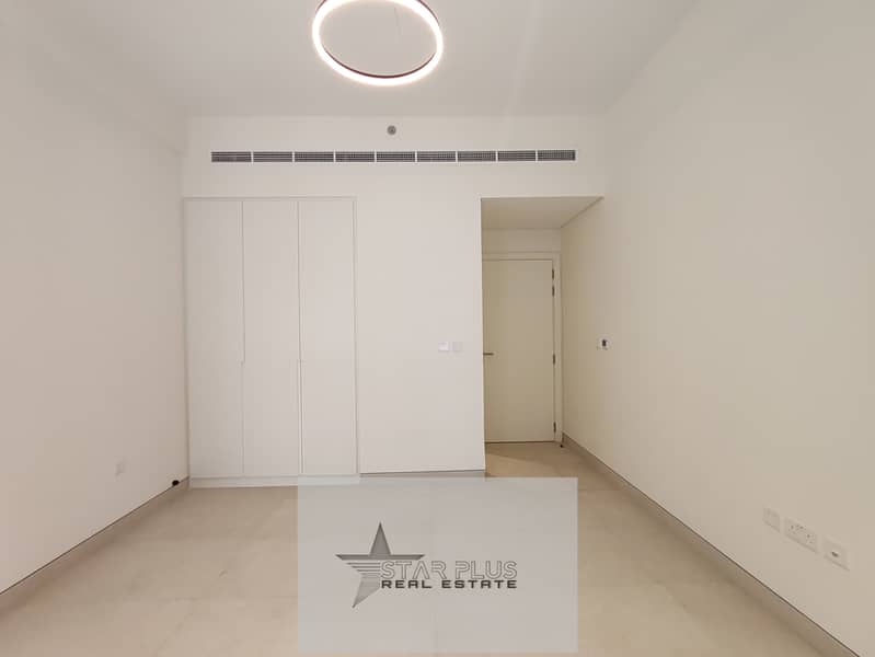 BRAND NEW SPACIOUS 1 BEDROOM APARTMENT WITH CLOSED KITCHEN,2 BALCONIES HAVING GYM,POOL AND COVERED PARKING.